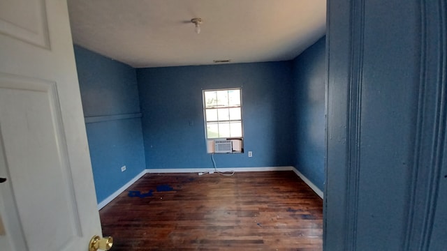 empty room featuring dark hardwood / wood-style flooring