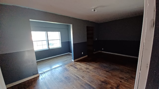 empty room featuring hardwood / wood-style floors