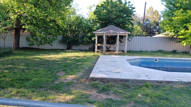 view of swimming pool featuring a gazebo and a lawn