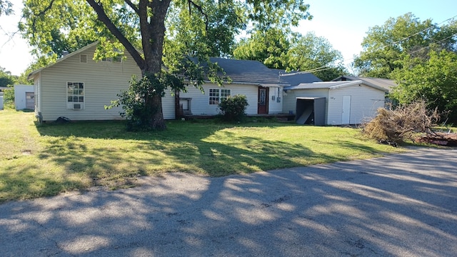 ranch-style home with a front lawn