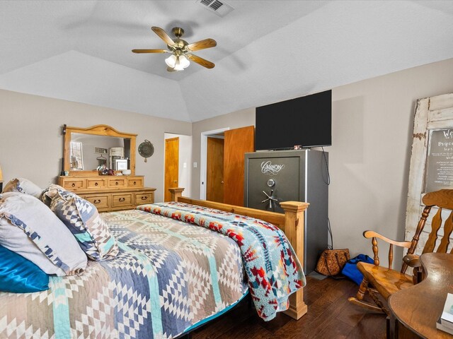 bedroom featuring vaulted ceiling, ceiling fan, wood finished floors, and visible vents