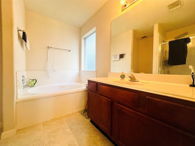 bathroom with tile patterned flooring, vanity, and plus walk in shower