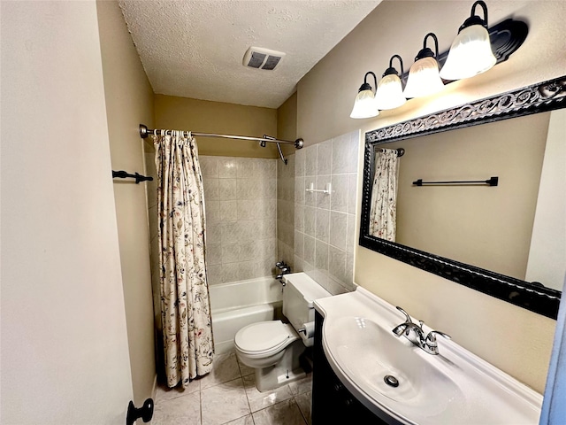 full bathroom featuring tile patterned flooring, vanity, toilet, a textured ceiling, and shower / bath combo with shower curtain