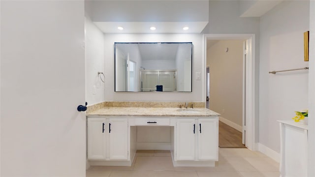 bathroom featuring vanity and walk in shower