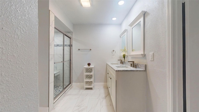 bathroom with vanity and an enclosed shower