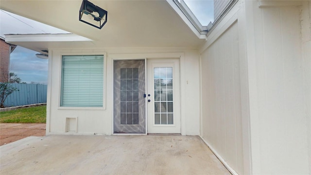 entrance to property with a patio area