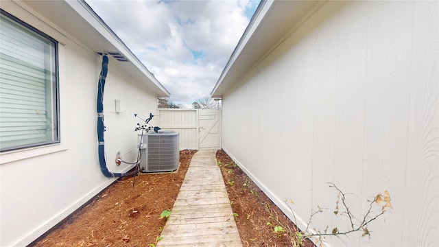 view of side of property featuring central air condition unit