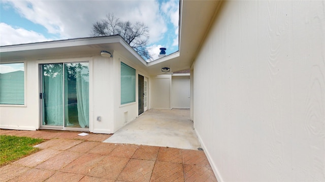 entrance to property with a patio