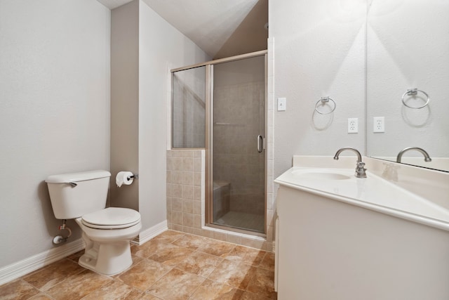 bathroom featuring vanity, tile patterned floors, a shower with door, and toilet