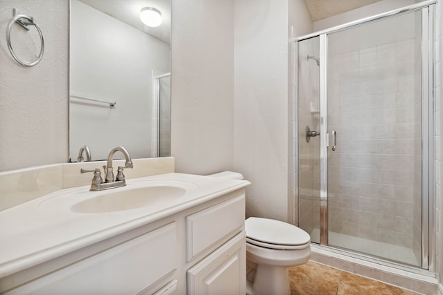 bathroom with vanity, walk in shower, and toilet