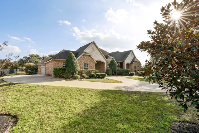 view of front of home with a garage and a front yard