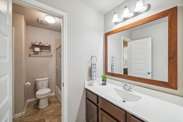 full bathroom featuring enclosed tub / shower combo, vanity, and toilet