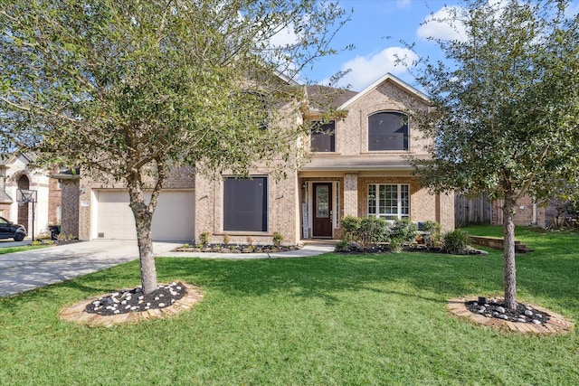 view of front of property with a front yard and a garage