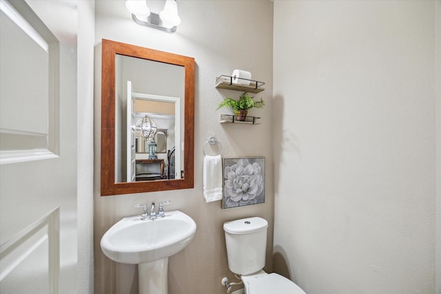 bathroom with sink and toilet