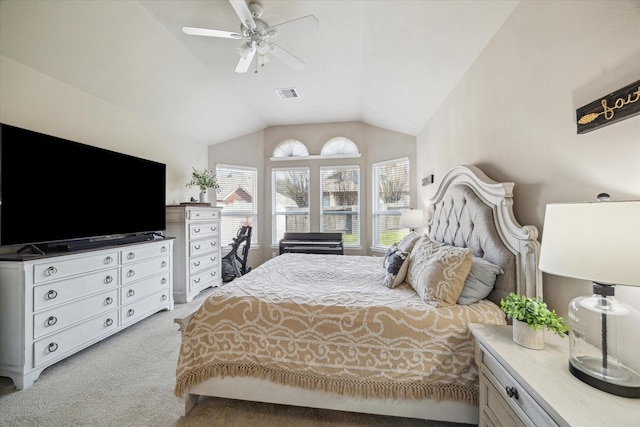 bedroom featuring ceiling fan, light carpet, and lofted ceiling