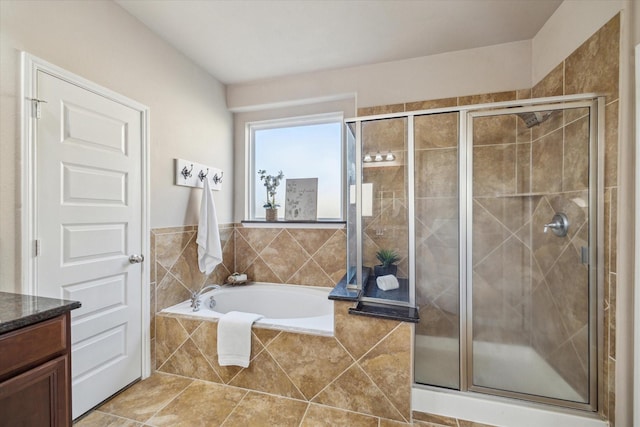 bathroom with plus walk in shower and vanity