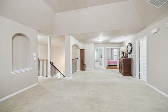 carpeted spare room featuring lofted ceiling