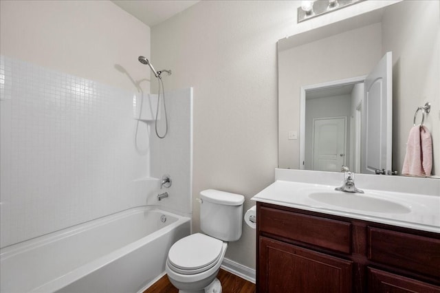 full bathroom featuring vanity, wood-type flooring, bathing tub / shower combination, and toilet