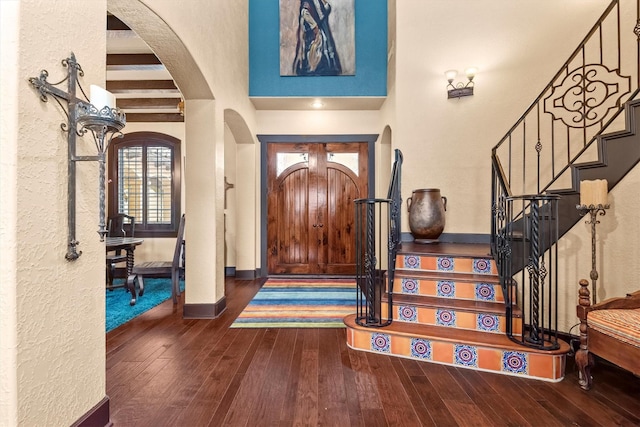 foyer with dark wood-type flooring