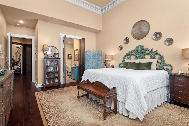 bedroom featuring crown molding and dark hardwood / wood-style floors