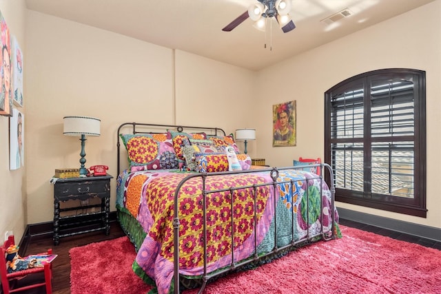 bedroom featuring ceiling fan and dark hardwood / wood-style flooring