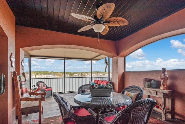 exterior space featuring a wealth of natural light and ceiling fan