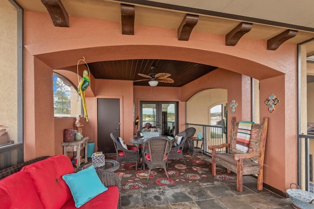 view of patio featuring an outdoor living space, ceiling fan, and french doors