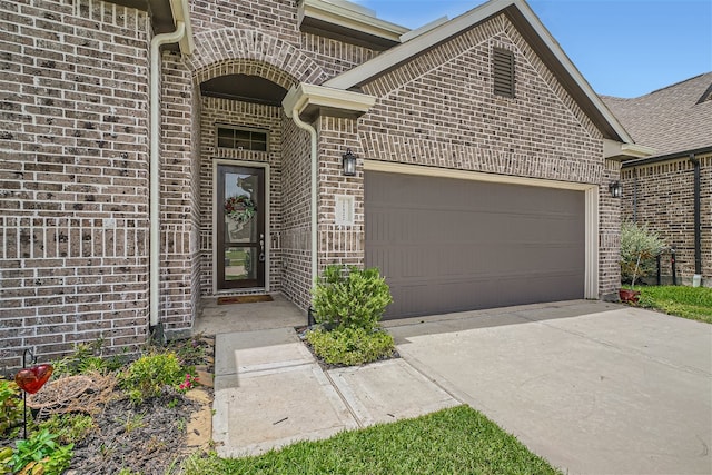 doorway to property featuring a garage