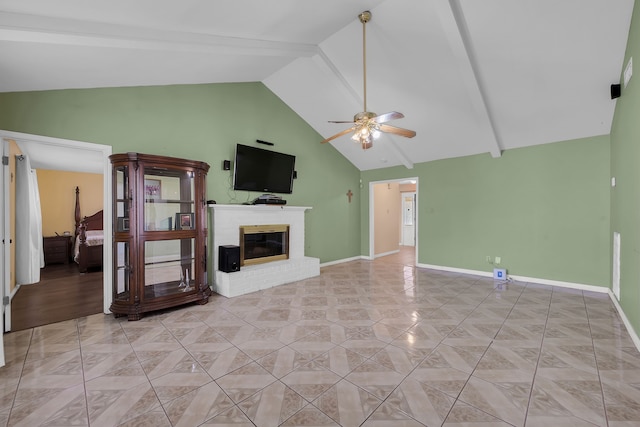 unfurnished living room with a brick fireplace, high vaulted ceiling, ceiling fan, and light tile patterned floors