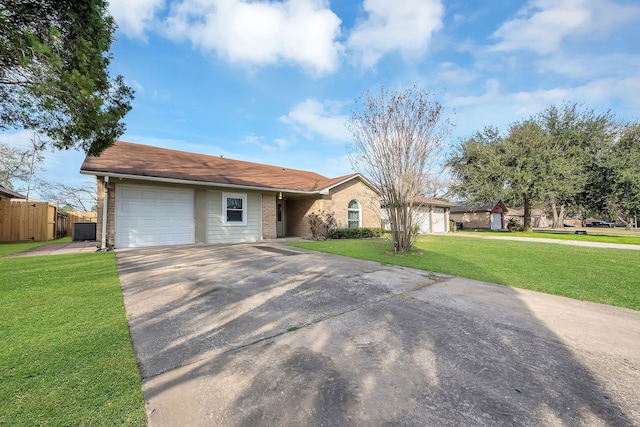 single story home with a garage and a front yard