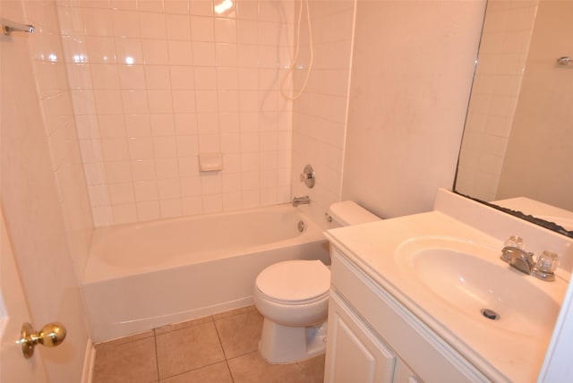 full bathroom featuring vanity, tiled shower / bath combo, tile patterned floors, and toilet