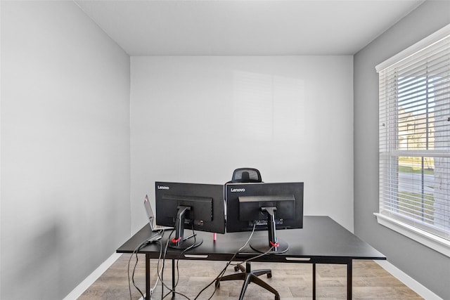 office featuring baseboards and wood finished floors