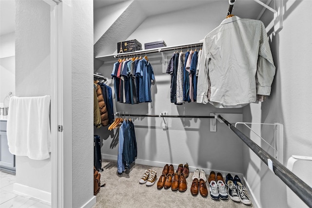 spacious closet featuring carpet floors