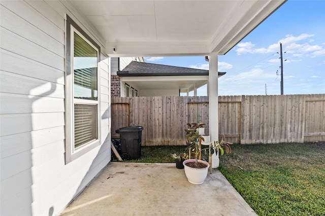 view of patio / terrace featuring fence