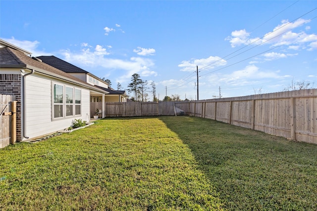 view of yard featuring a fenced backyard