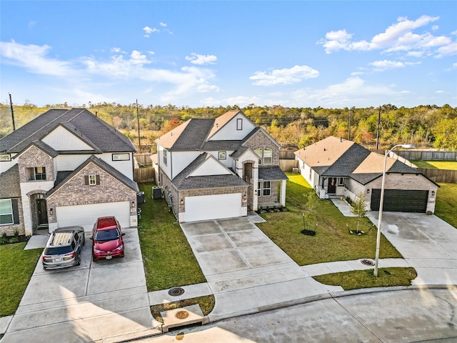 view of front of house with driveway, stone siding, a garage, and a front yard