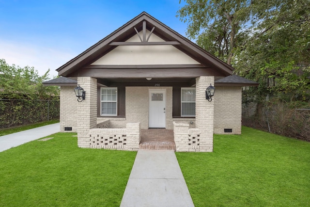 view of front of home featuring covered porch and a front yard