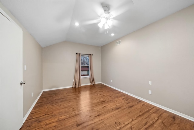 empty room featuring visible vents, baseboards, ceiling fan, and wood finished floors