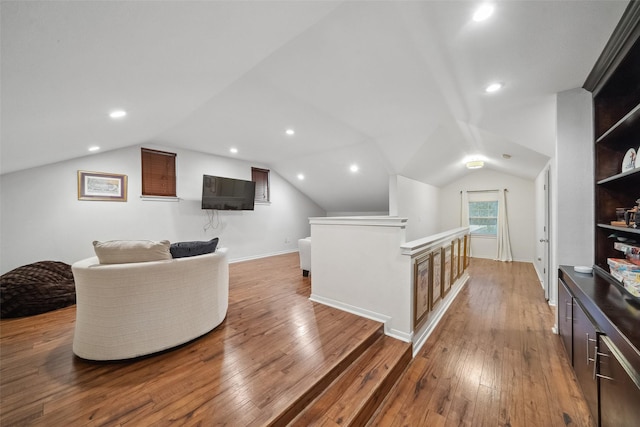 interior space featuring lofted ceiling, recessed lighting, and light wood-style floors