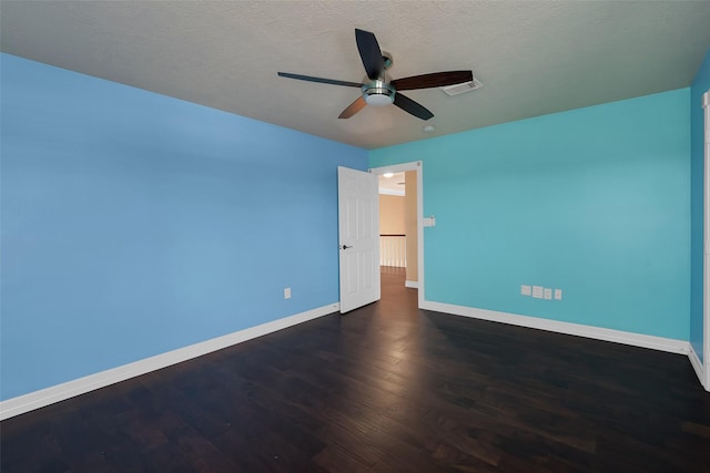 unfurnished bedroom featuring ceiling fan, dark hardwood / wood-style flooring, and a textured ceiling