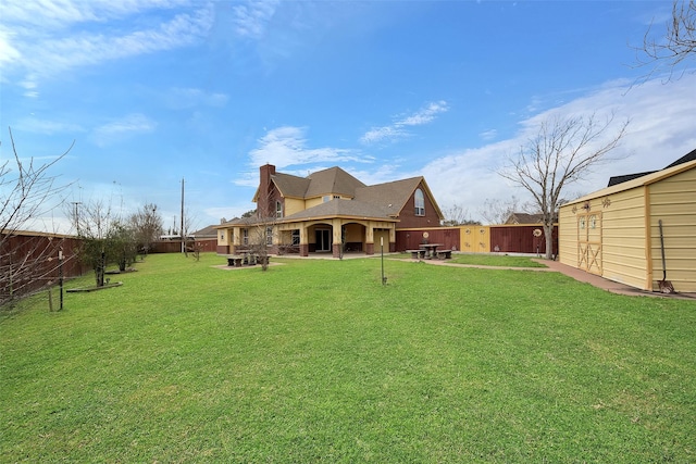 rear view of property featuring a yard