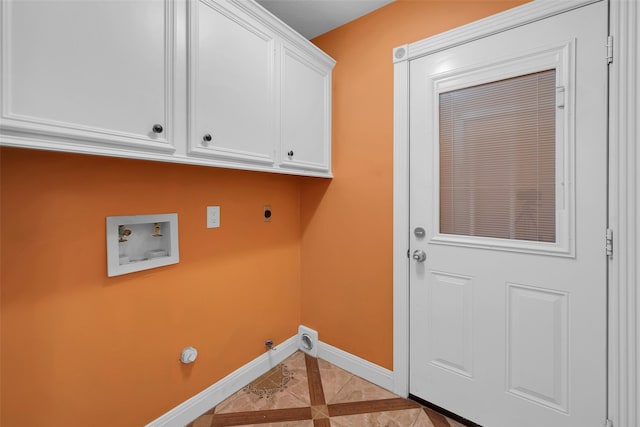 washroom featuring washer hookup, hookup for a gas dryer, cabinets, and hookup for an electric dryer