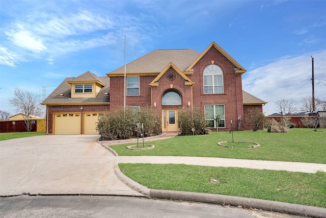 view of property with a garage and a front lawn