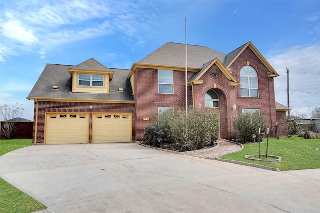 front facade featuring a garage and a front lawn