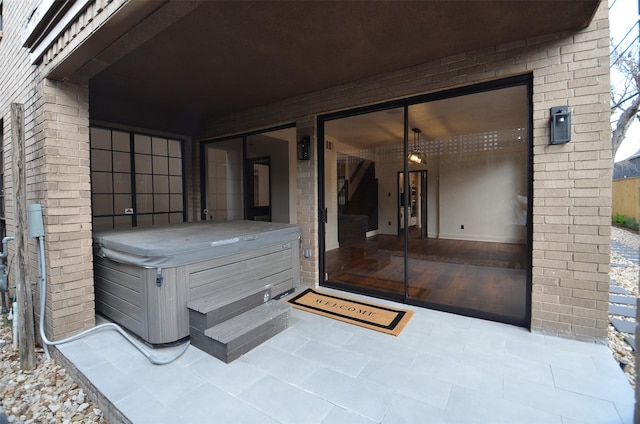 view of patio with a hot tub