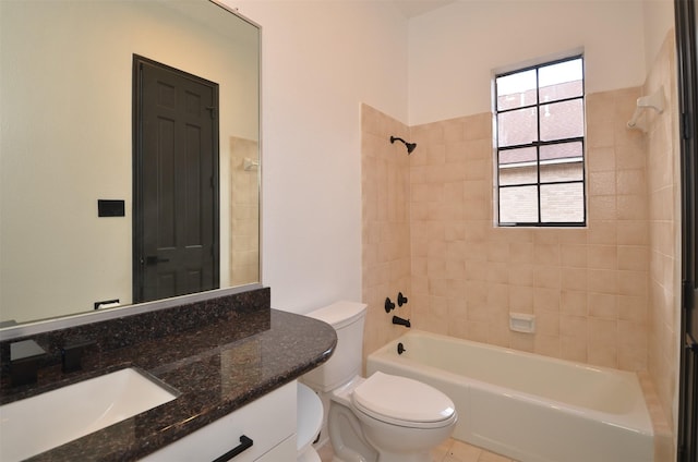 bathroom featuring vanity, toilet, and bathtub / shower combination