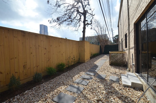 view of yard with a fenced backyard