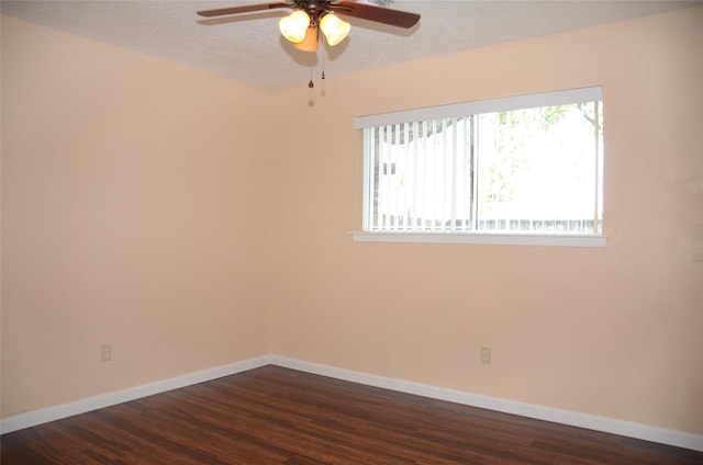 unfurnished room featuring ceiling fan, dark hardwood / wood-style flooring, and a textured ceiling