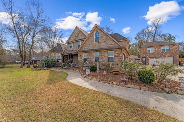 view of front of house with a garage and a front lawn