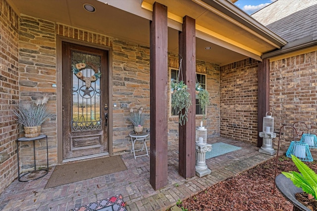 view of exterior entry featuring a porch